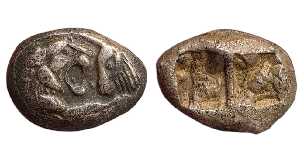 Siglos lydien en argent représentant les têtes affrontées d'un lion et d'un taureau.